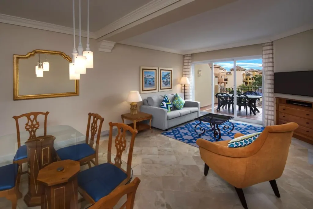 Spacious living room at Marriott Vacation Club Resort featuring elegant furniture and balcony views.