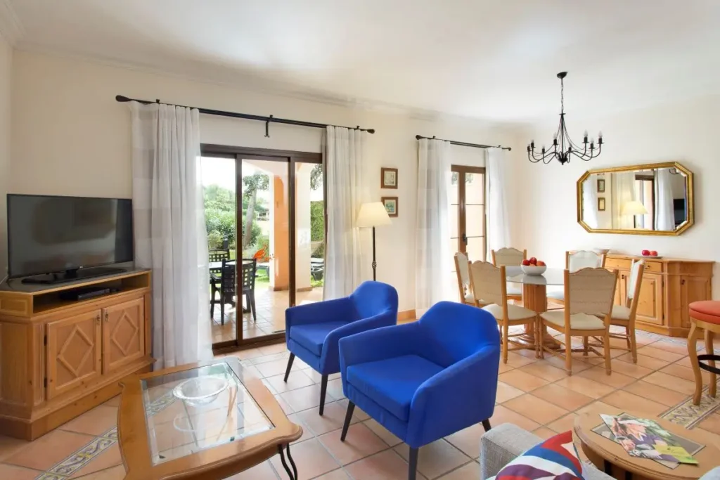 Cozy living room and stylish dining table in a Villa at Marriott's Club Son Antem in Mallorca, Spain.